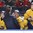 BUFFALO, NEW YORK - JANUARY 4: Sweden's Isac Lundestrom #20 is tended to by trainer on the bench while teammates look on during semifinal round action at the 2018 IIHF World Junior Championship. (Photo by Matt Zambonin/HHOF-IIHF Images)

